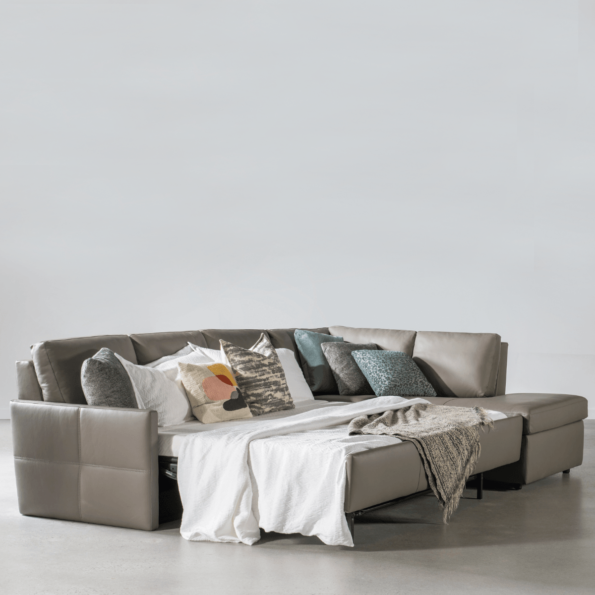 Leather sofa sleeper sales sectional